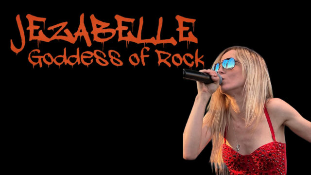 A woman with long blonde hair sings into a microphone, wearing sunglasses and a red top, with the text 