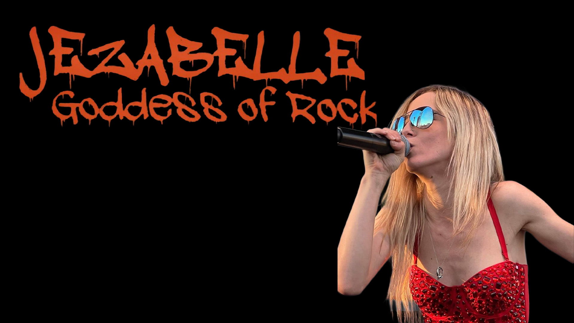 A woman with long blonde hair sings into a microphone, wearing sunglasses and a red top, with the text 