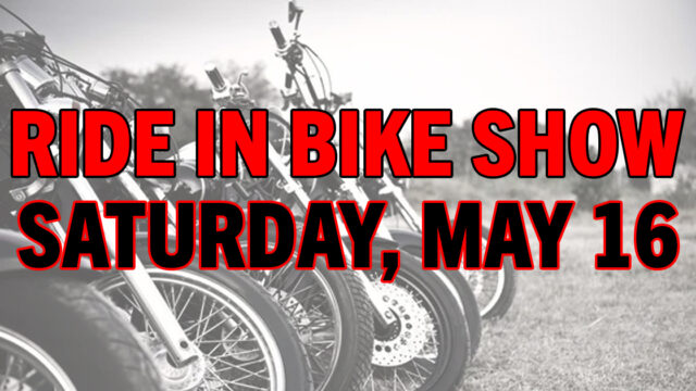 Several motorcycles lined up on grass with large red and black text over the image that reads: 