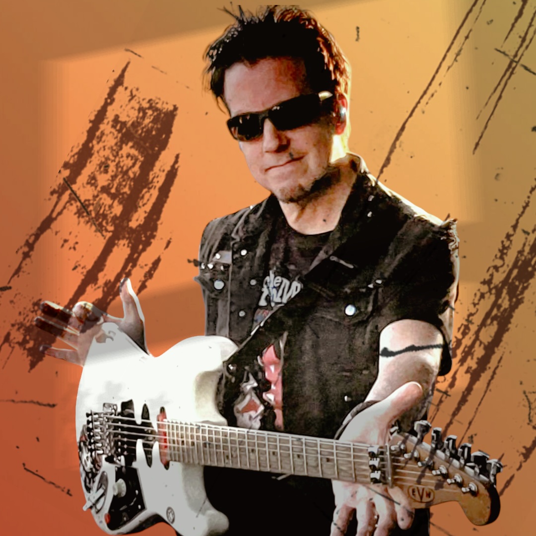 A man wearing sunglasses holds a white electric guitar against an orange, textured background.